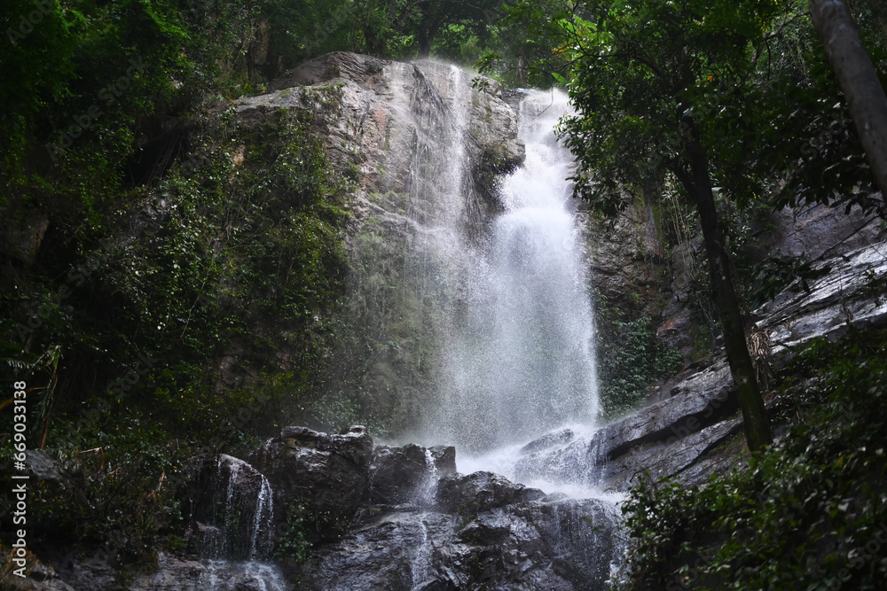 Obraz premium Beautiful scenery of the waterfall in the rainforest in Thailand. Adventure and travel concept