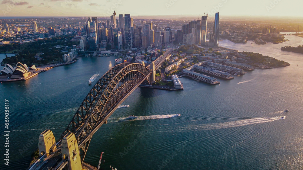 Naklejka premium Aerial drone view of Sydney City and Sydney Harbour showing Sydney Harbour Bridge in the late afternoon 