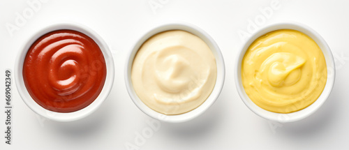 Bowls of ketchup, mayonnaise, and mustard.