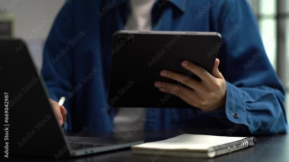 Learning online working concept. Businesswoman working on tablet and laptop computer, searching working in office. Learning online working concept. Businesswoman working on tablet and laptop computer, searching working in office.