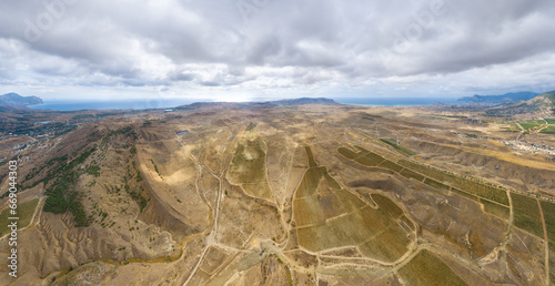 Sudak, Crimea. Vineyards near the village of Solnechnaya Dolina. Autumn. Aerial view photo