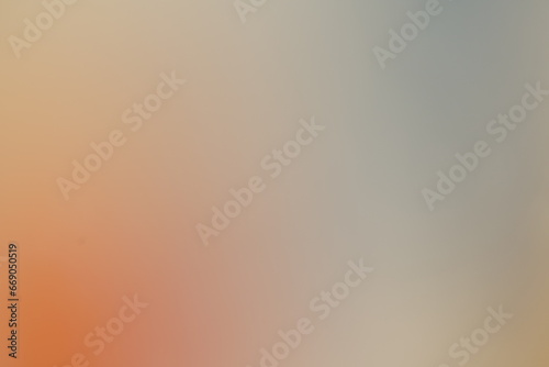 Weicher heller Verlauf von Farbe in sanften Tönen aus orange und blau photo