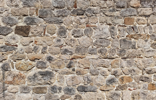 Background of old stone blocks, masonry wall, texture of stonework, pattern of grunge rock wall.
