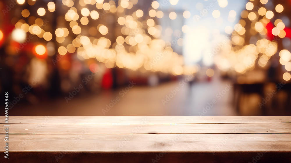 Oak wooden table, empty for mockup, on defocused background with warm and cozy decorated Christmas street with houses and lights at night. Urban Christmas scene with an empty wooden table 