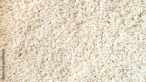 Above view of raw rice or raw sticky rice. for food background and textured.
