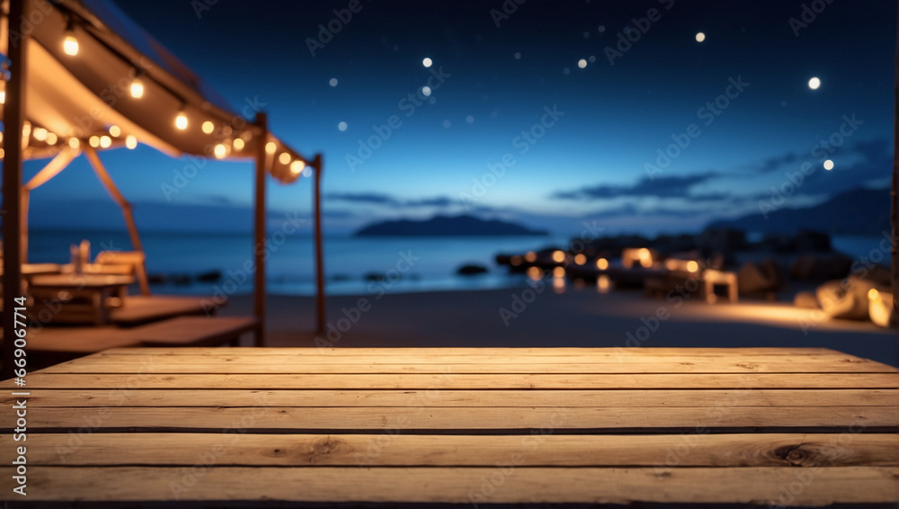 Wooden table top on blur tent camping travel on the beach at night