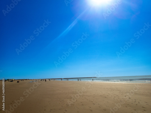Obraz w ramie View of the large Isla Canela Beach, in Ayamonte, Spain, on a sunny day.
