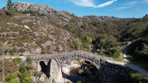 Aerial Photography of Cava da Velha Stone Bridge in Castro Laboreiro Village. Natural Park of Gerês, Portugal photo