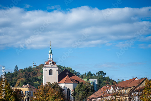 Tower of church of St. James with autumn sky - Husovo náměstí, Beroun, Czech Republic