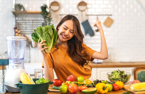 Portrait of beauty body slim healthy asian woman having fun cooking and preparing vegan food healthy eat with fresh vegetable salad, vegetarian on counter in kitchen at home.Diet.Fitness, healthy food