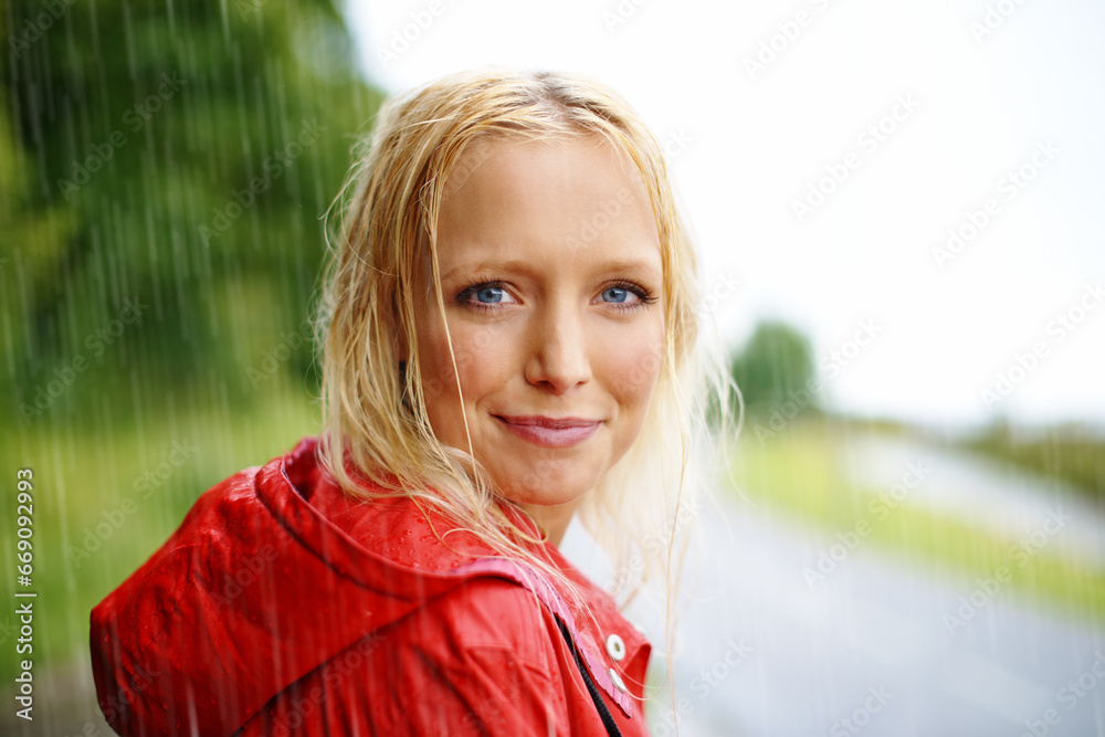 Friendly, portrait and young woman in the rain with coat in nature, road or street for winter. Smile, positive attitude and female person from Australia in drizzle or storm weather in outdoor forest. Friendly, portrait and young woman in the rain with coat in nature, road or street for winter. Smile, positive attitude and female person from Australia in drizzle or storm weather in outdoor forest.