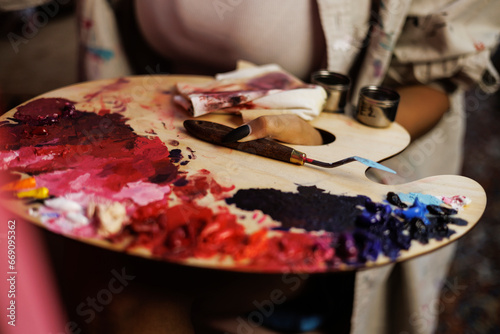 Obraz na płótnie Partial shot of african american female artist holding painting palette and knif