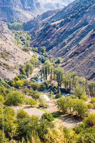 view of Azat River in gorge in Gegham mountains of Armenia near Garni village on sunny autumn day photo