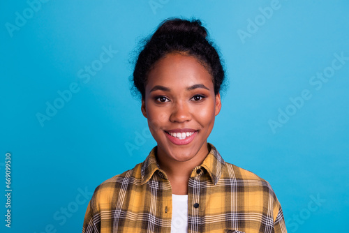 Pretty smiling female with fair hair, dressed casually, looking with satisfaction being happy. Studio shot of good-looking beautiful woman isolated against blank studio wall