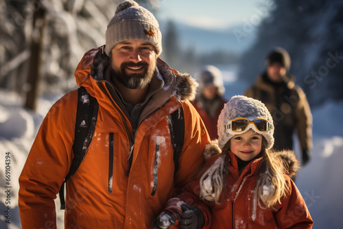Father and daughter having fun in ski resort on the mountains in winter. Snowboarding or skiing in family. Family time outdoors in winter season.
