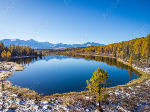 Scenic view of calm Kidelu lake and mountain range in Altai Republic, Siberia, Russia