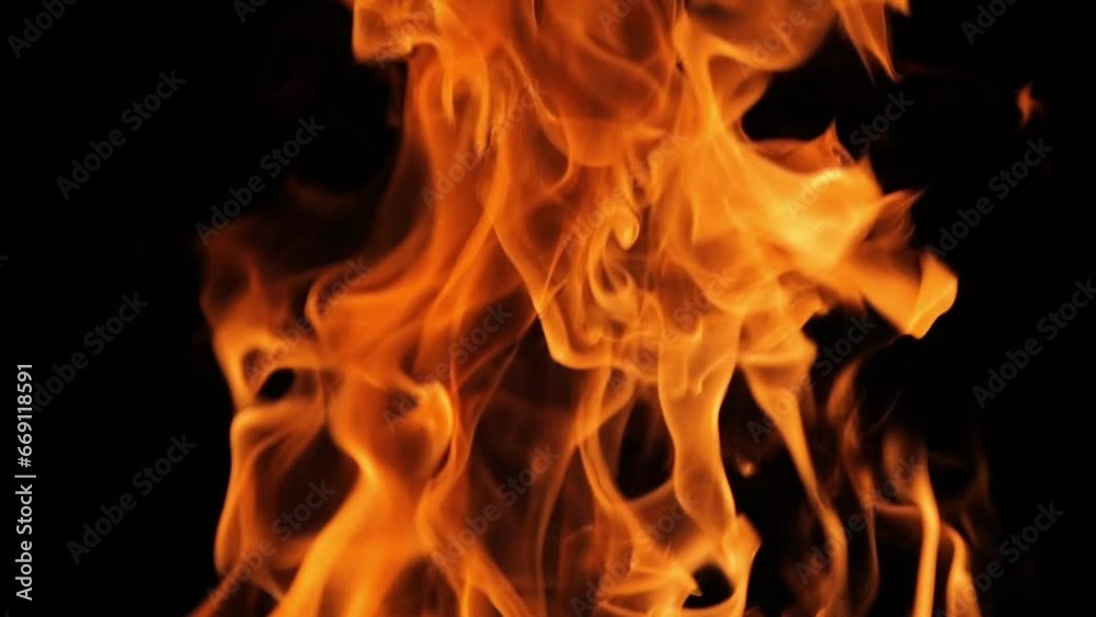 Flames and sparks of fire on a black background. A big bonfire. Fire and danger. Burning wood in the fireplace. Romantic fire. Fire at night. Flames and sparks of fire on a black background. A big bonfire. Fire and danger. Burning wood in the fireplace. Romantic fire. Fire at night.
