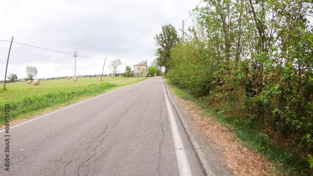 Via Francigena - a country road through agricultural fields next to San Rocco, municipality of Busseto, province of Parma, Emilia-Romagna, Italy Via Francigena - a country road through agricultural fields next to San Rocco, municipality of Busseto, province of Parma, Emilia-Romagna, Italy