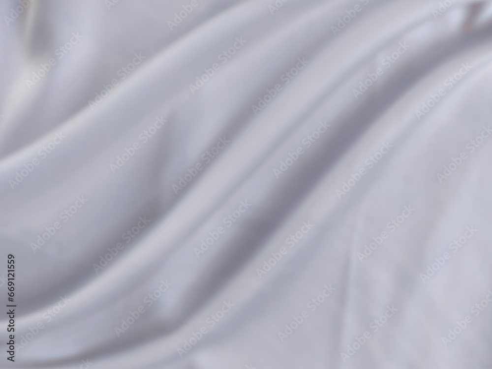 White and gray satin fabric has wavy folds and blurred patterns. beautiful and natural White and gray satin fabric has wavy folds and blurred patterns. beautiful and natural
