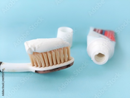 Toothbrush with white paste as a tooth cleaning tool