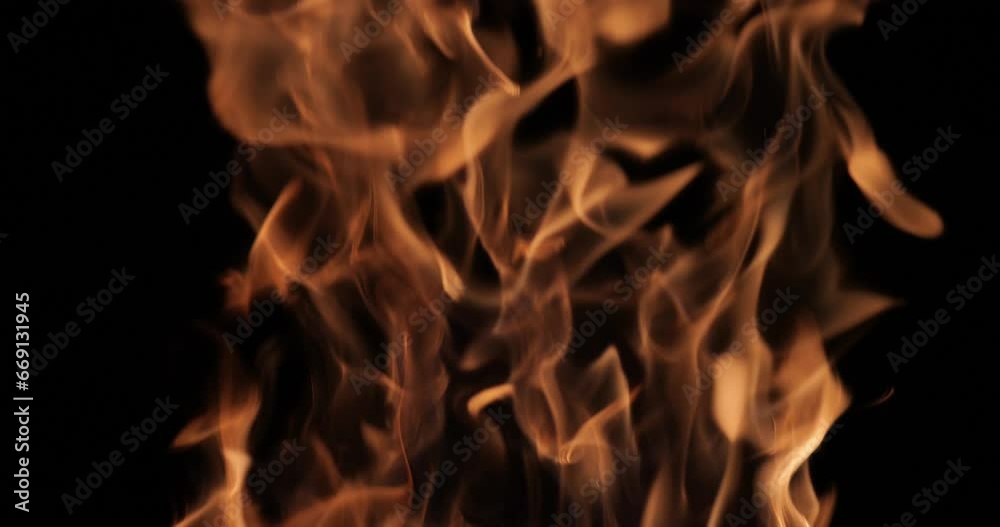 Flames and sparks of fire on a black background. A big bonfire. Fire and danger. Burning wood in the fireplace. Romantic fire. Fire at night. Flames and sparks of fire on a black background. A big bonfire. Fire and danger. Burning wood in the fireplace. Romantic fire. Fire at night.