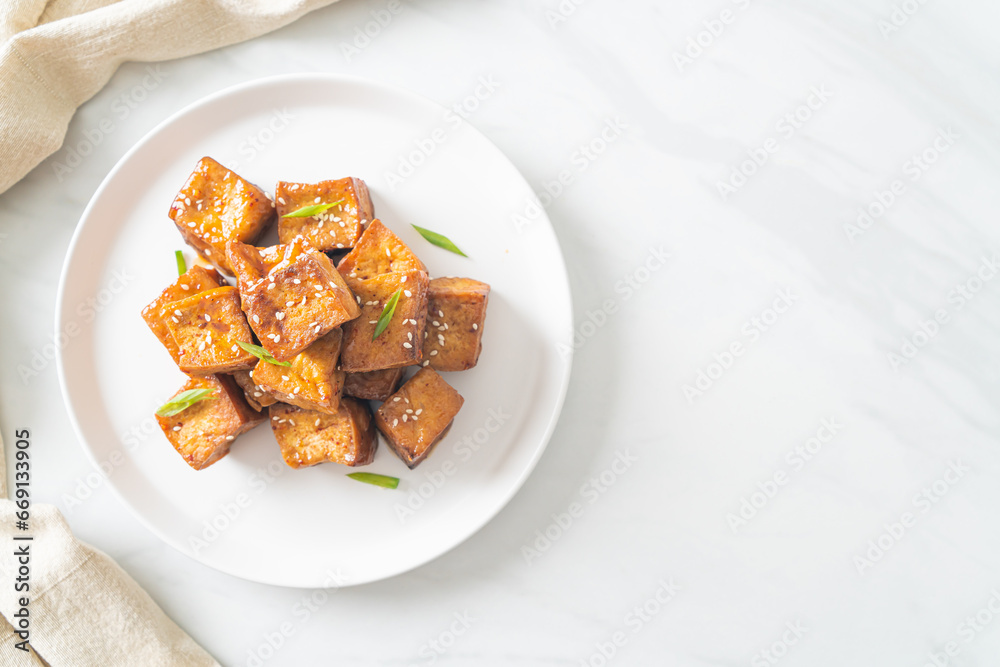 fried tofu with white sesame and teriyaki sauce fried tofu with white sesame and teriyaki sauce