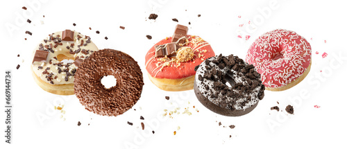 Assorted set colorful glazed donuts with mixed sprinkles and crumbs flying isolated on white background. Sweet pastry card. Fresh baked white, brown, pink, red doughnuts photo