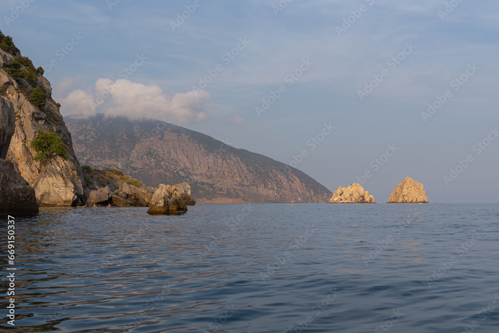 Summer boat trip to the rocks of Adalary and Mount Ayu-Dag (Bear) in the village of Gurzuf. Crimea, Russia. 31.08.2023