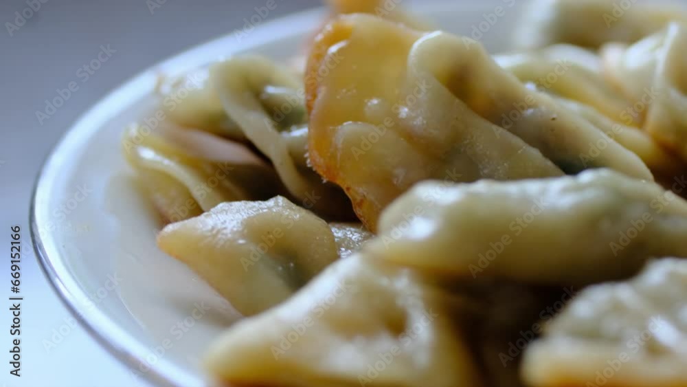 Serving Gyoza dumplings, a local Chinese and Japanese common food