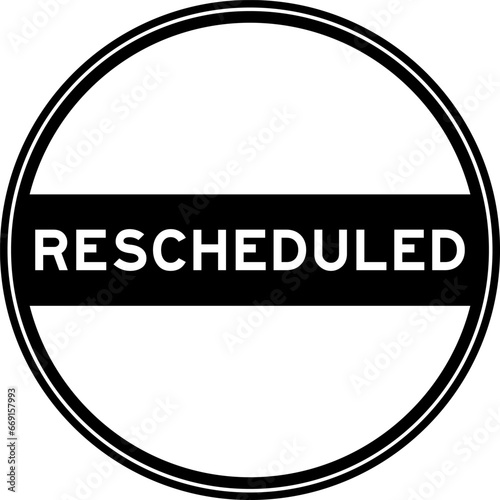 Black color round seal sticker in word rescheduled on white background