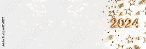 Greeting banner - happy new year with numbers 2024 and gold glitter and stars on white background