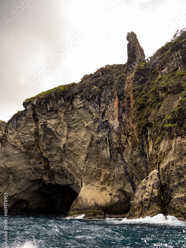 The incredible rooster's cave, the name is due to its shape. It can be seen by boat trip along the rugged coast of Flores Island.