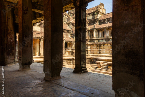 Columns and in the background you can see one of the inner courtyards of the ancient temple of Angkor Wat  in Cambodia.