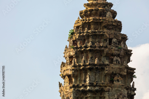 Stone pagoda or tower, decorated with reliefs and horn details at the temple of Angkor Wat, Cambodia