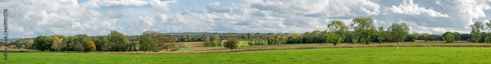 Wide panorama of beautiful Cotswold landscape on a sunny autumn day with  a long vista. English countryside