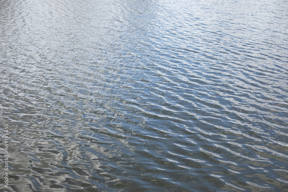 Texture of water. Waves on lake. Surface of pond. Texture of water. Waves on lake. Surface of pond.