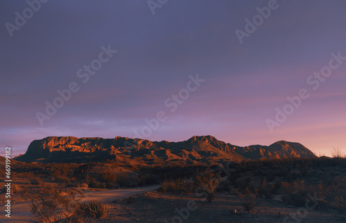 Sunset Fades To Pink and Orange Over The Western Side Of The Chisos Mountains