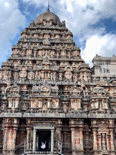 Tower of Airavatesvara Temple, Darasuram, Kumbakonam, Tamilnadu. Hindu temple gopuram with blue sky cloudy background.