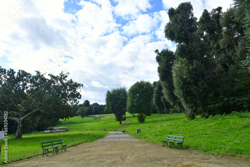 An avenue in the city park of a royal palace in Naples, Italy.