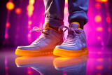 Legs in gray sweatpants and white sneakers with bright yellow soles on a pink background with lights. Generative ai