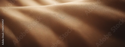 porous rough beige ocher faux leather. Textured dense fabric draped with folds and waves. horizontal background or backdrop