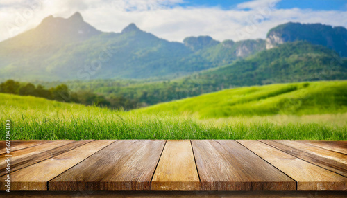 wooden table top on blur mountain and grass field fresh and relax concept for montage product display or design key visual layout view of copy space