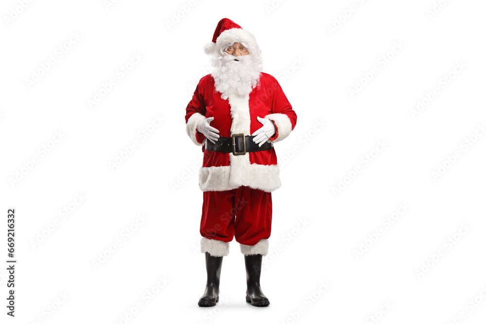 Full length portrait of santa claus standing with hands on his belly Full length portrait of santa claus standing with hands on his belly