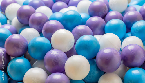 heap of colorful plastic balls in white blue and purple colors