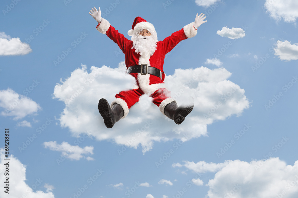 Cheerful santa claus floating on clouds