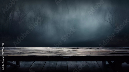 empty wooden table with blurry foggy mountain background