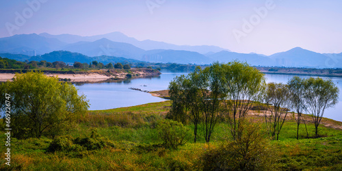 Daegu City nature landscape in autumn, tranquil riverbank, forest, and mountain views over the wildlife conservation area in Nakdong River, South Korea