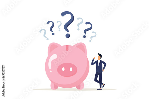 Wealth concept, confused businessman with piggy bank and question marks. Financial question or savings problem, doubt or confusion, banking or economic uncertainty, thoughts or money decision.