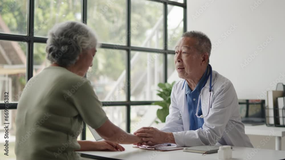 Doctor is advised treatment methods and recovery then touching patient hands for encouragement and support to old woman patient. Doctor is advised treatment methods and recovery then touching patient hands for encouragement and support to old woman patient.