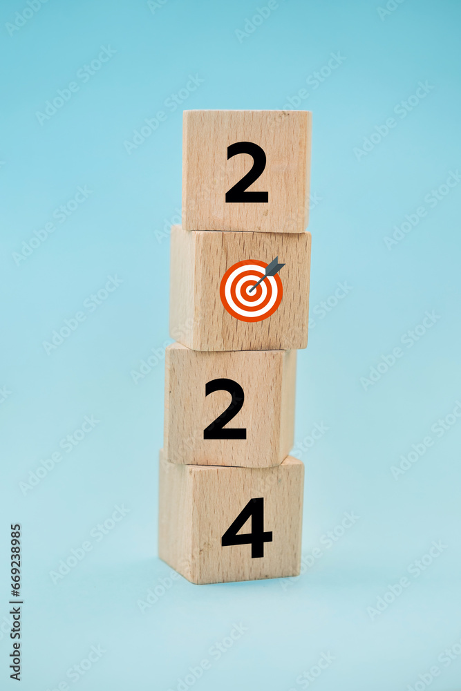2024 with goal icon on table and blue background, copy space. Start new year 2024 with goal plan, goal concept, action plan, strategy, new year business vision 2024 with goal icon on table and blue background, copy space. Start new year 2024 with goal plan, goal concept, action plan, strategy, new year business vision